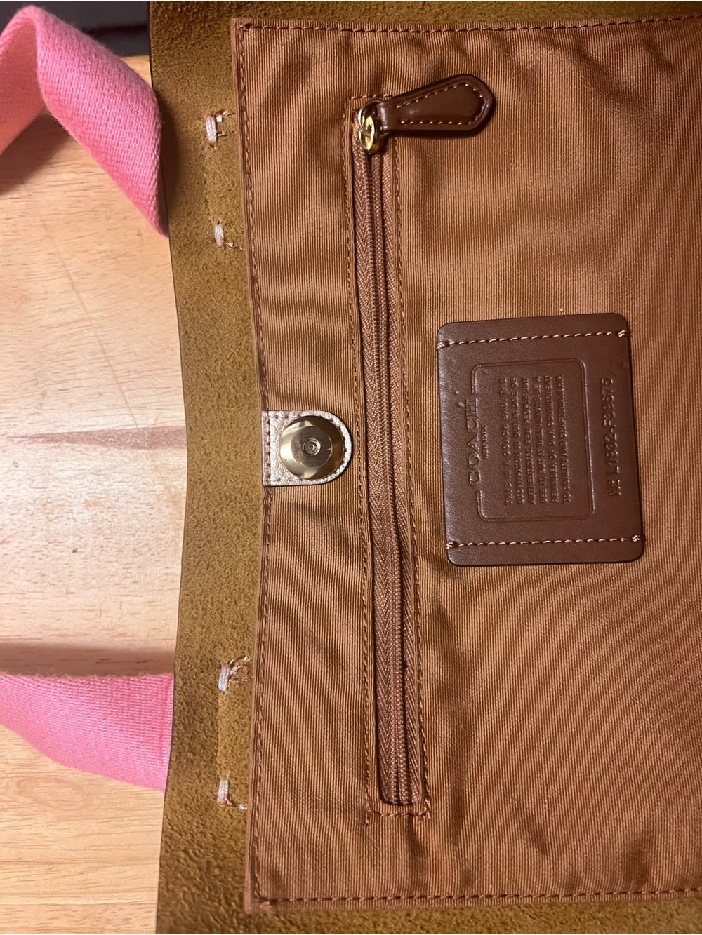 Coach Bronze colored with Pink Handles and Interior Zip Pocket